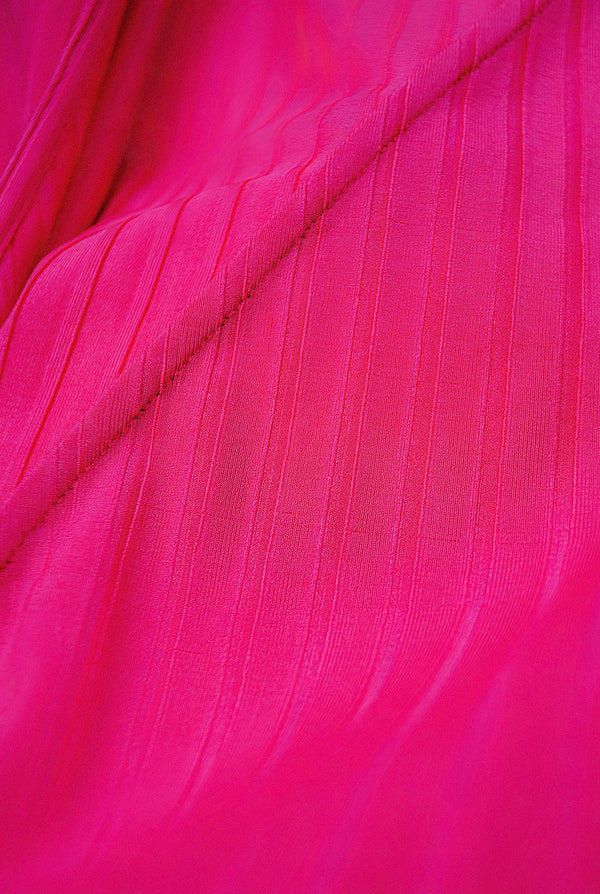 Blusa fucsia de manga larga