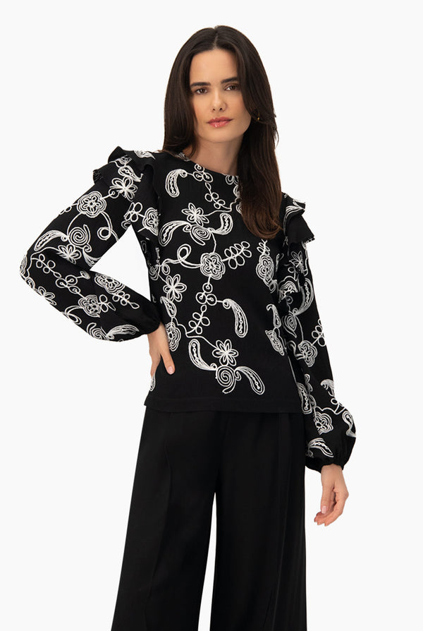 Blusa de manga larga y volantes