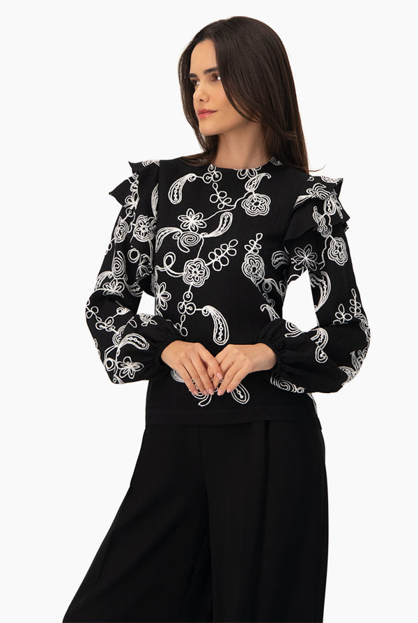 Blusa de manga larga y volantes