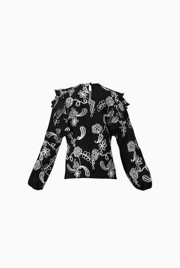 Blusa de manga larga y volantes