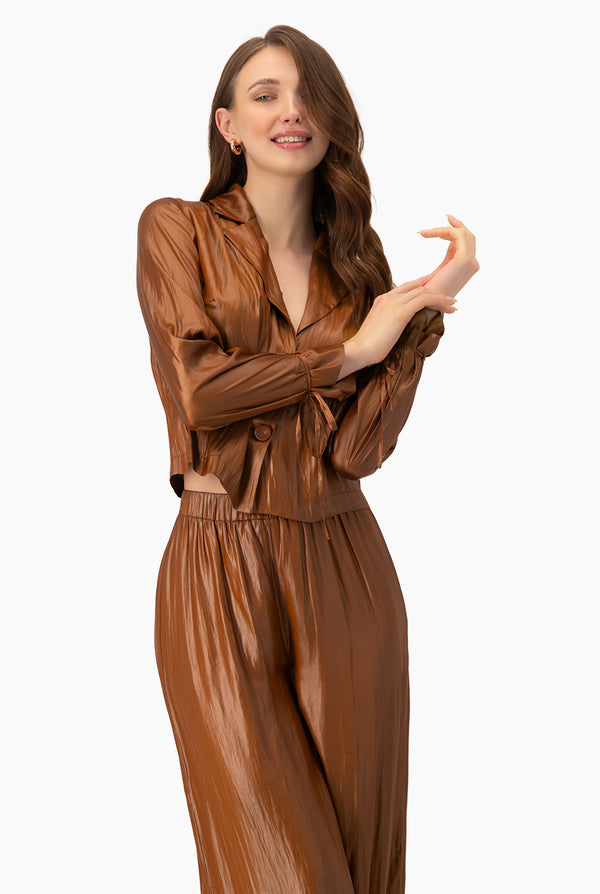 Blusa lisa con cintas en mangas