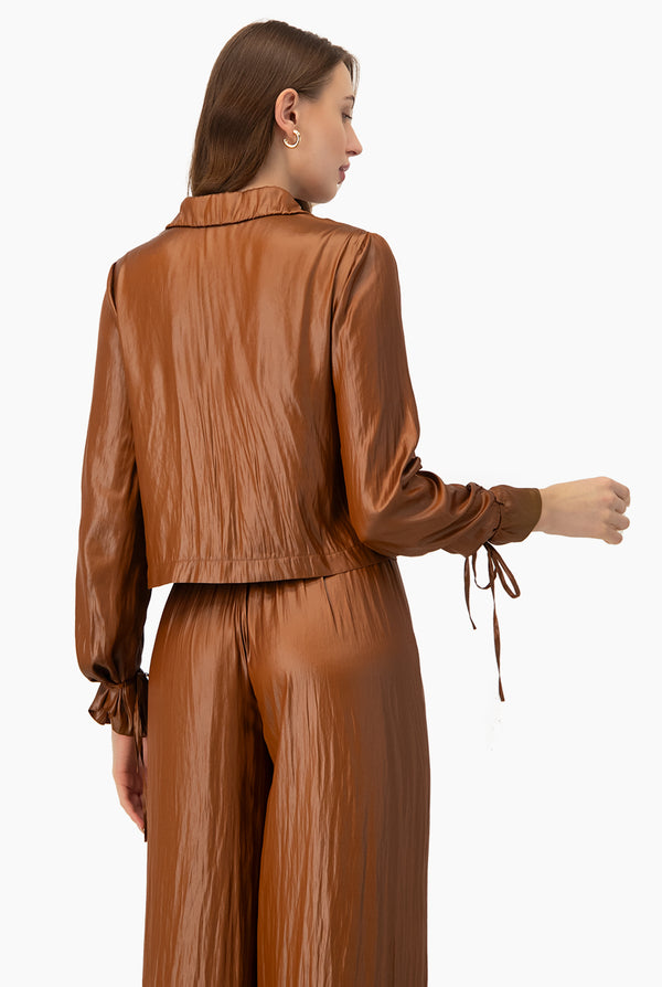 Blusa lisa con cintas en mangas