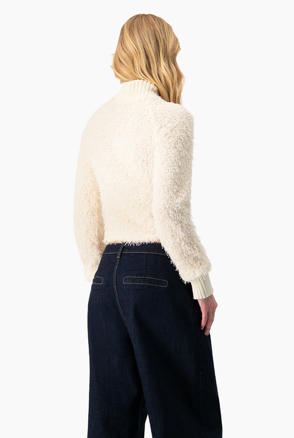 Blusa de flecos y manga larga