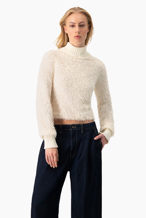 Blusa de flecos y manga larga